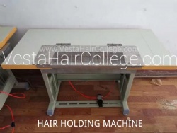 HAIR HOLDING MACHINE